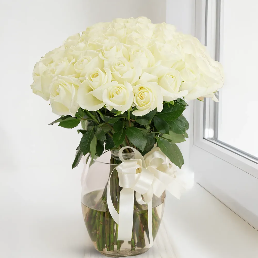 White Roses in Glass Vase