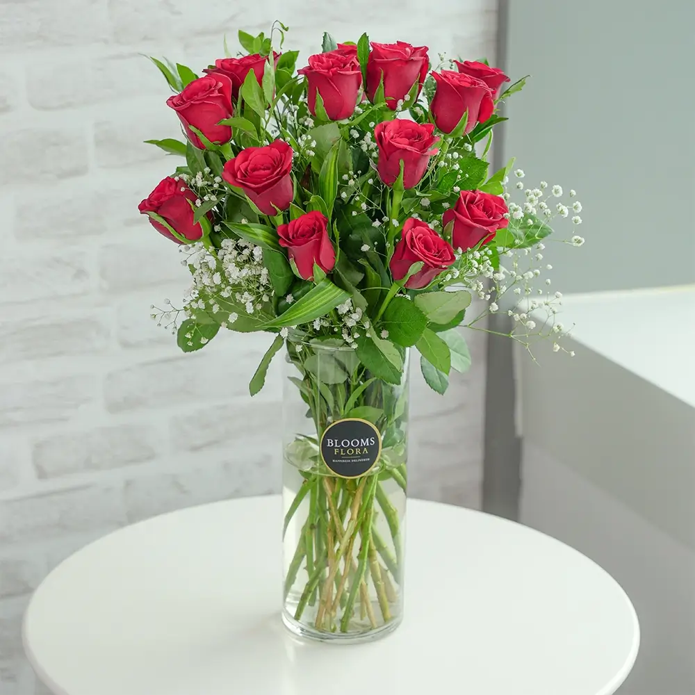 15 red roses in a vase