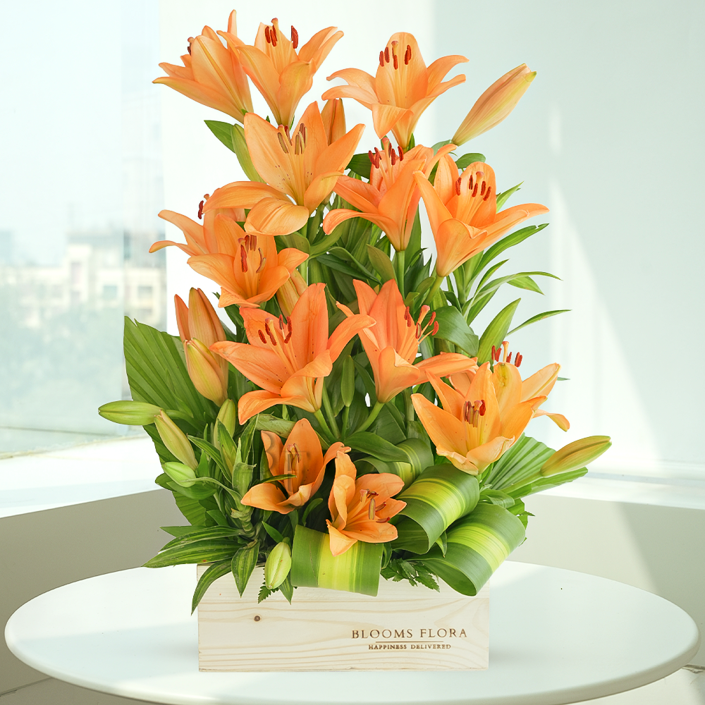10 orange lilies in a wooden box