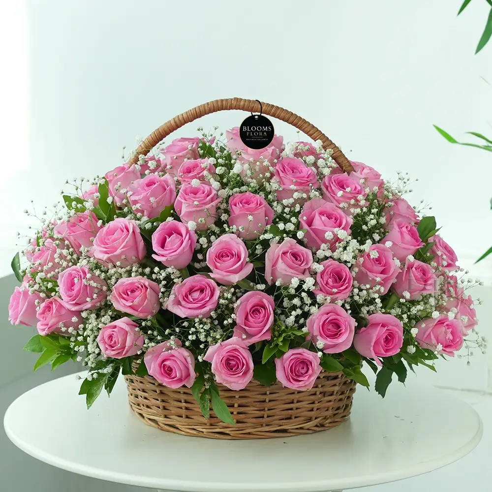 70 pink roses in a handle basket