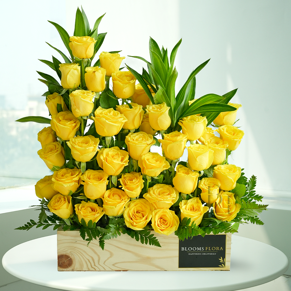 50 yellow roses in a wooden box