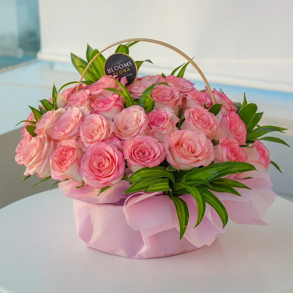 30 pink roses in a basket