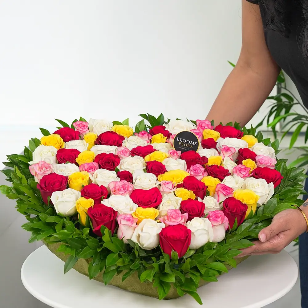 50 mixed roses heart shape arrangement in pink, yellow, white and red – romantic anniversary and Valentine's Day gift, same-day delivery India