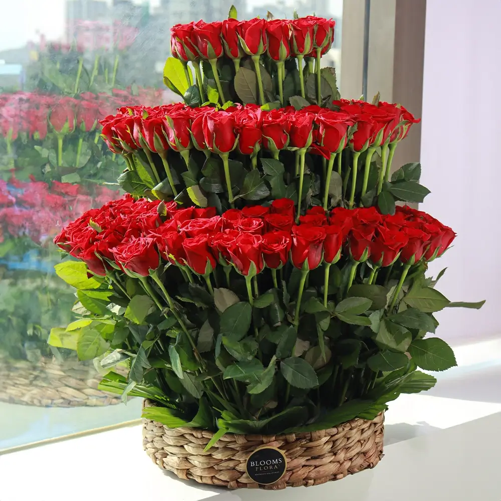 3 tier 100 red roses in a basket