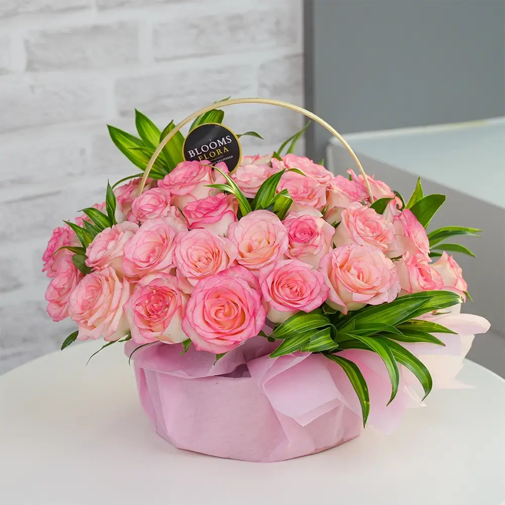 30 pink roses in a basket