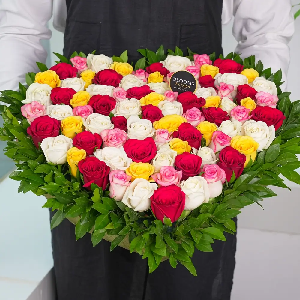 50 mixed roses heart shape arrangement in pink, yellow, white and red – romantic anniversary and Valentine's Day gift, same-day delivery India