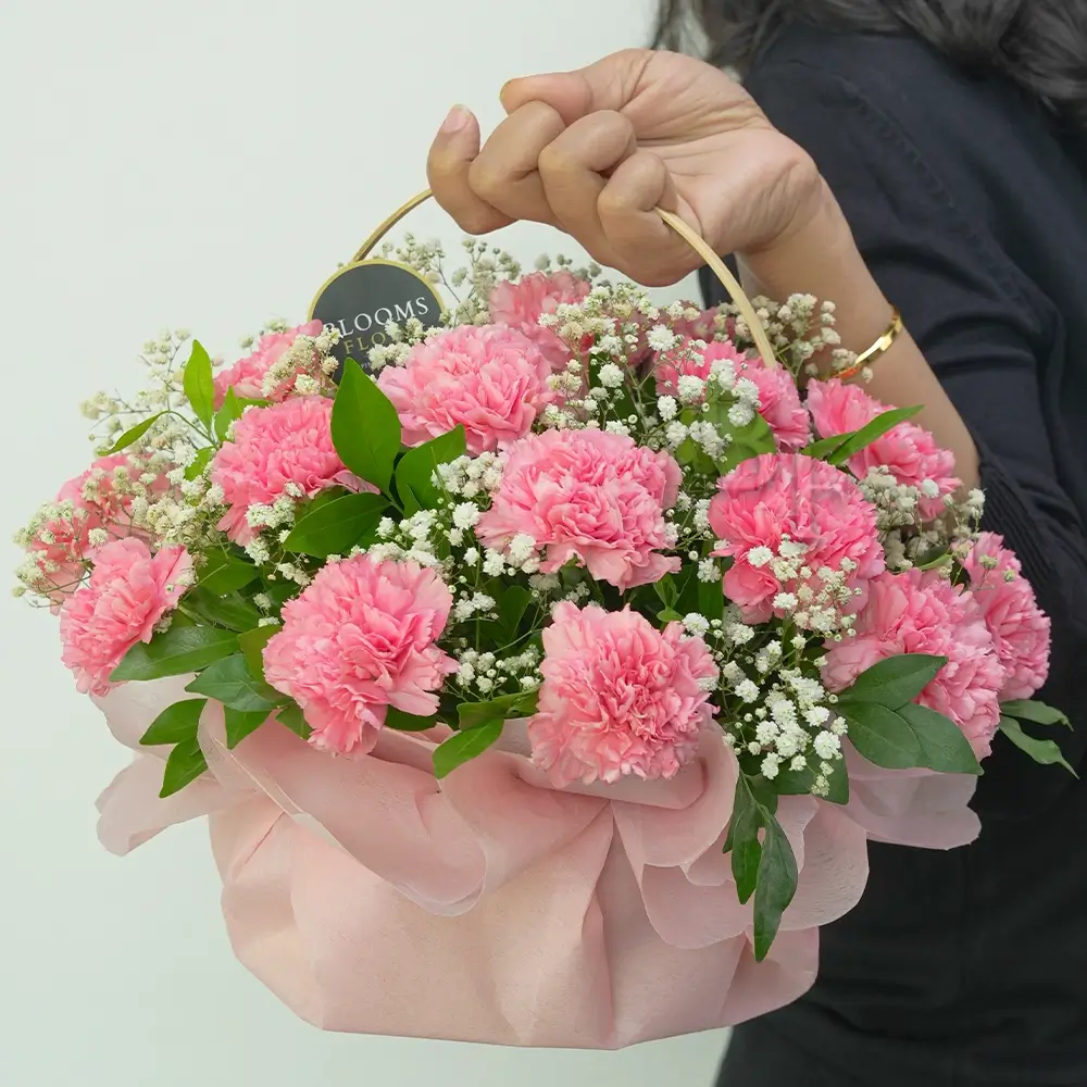 20 pink carnations in a basket