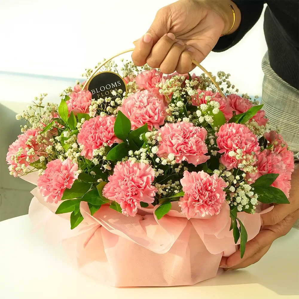 20 pink carnations in a basket
