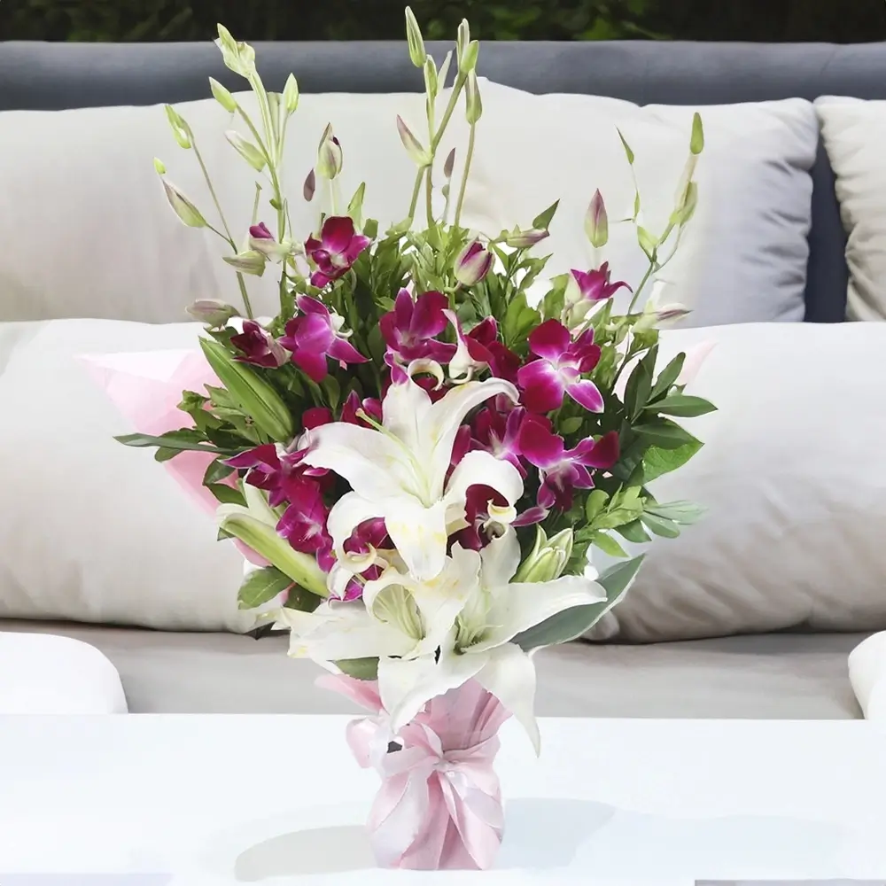 5 purple orchids and 2 white lilies bouquet