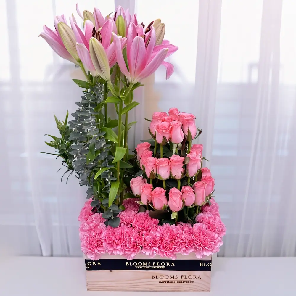 Pink Flowers Arranged in Wooden Tray