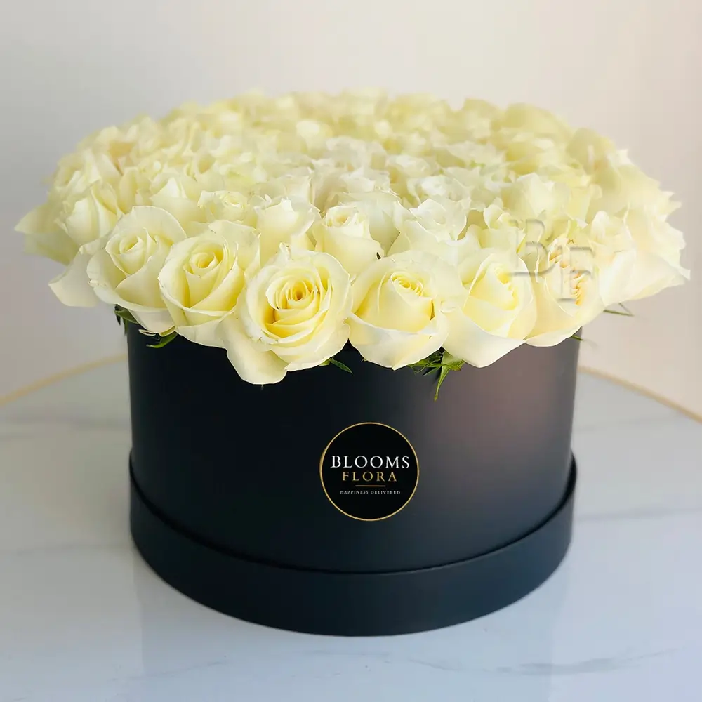 60 white roses in a black round box