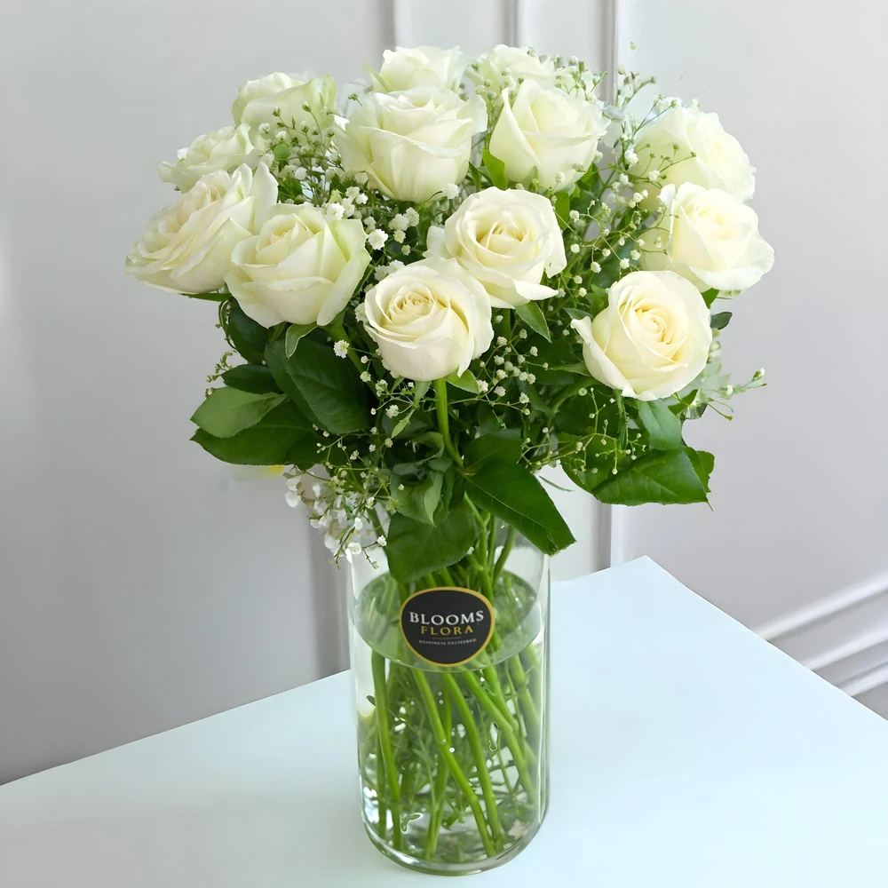 12 white roses in a vase