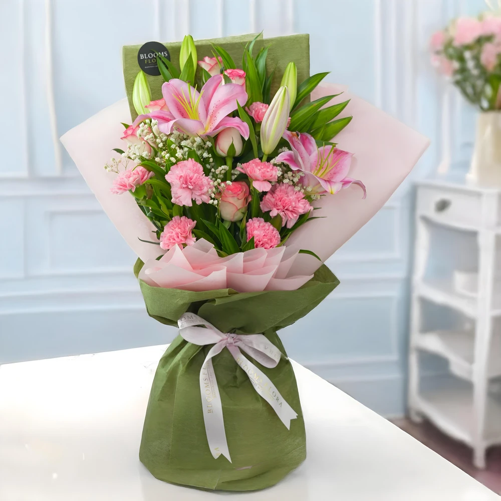 2 pink lilies, 6 pink roses, and 6 pink carnations bouquet