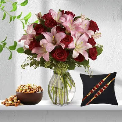 Bouquet of Roses & Lilies with Mixed Dry Fruits and Free Rakhis